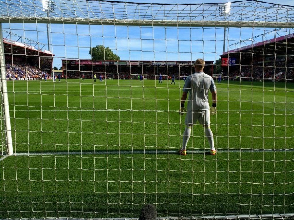 behind Leicester goalkeeper Schmeichel